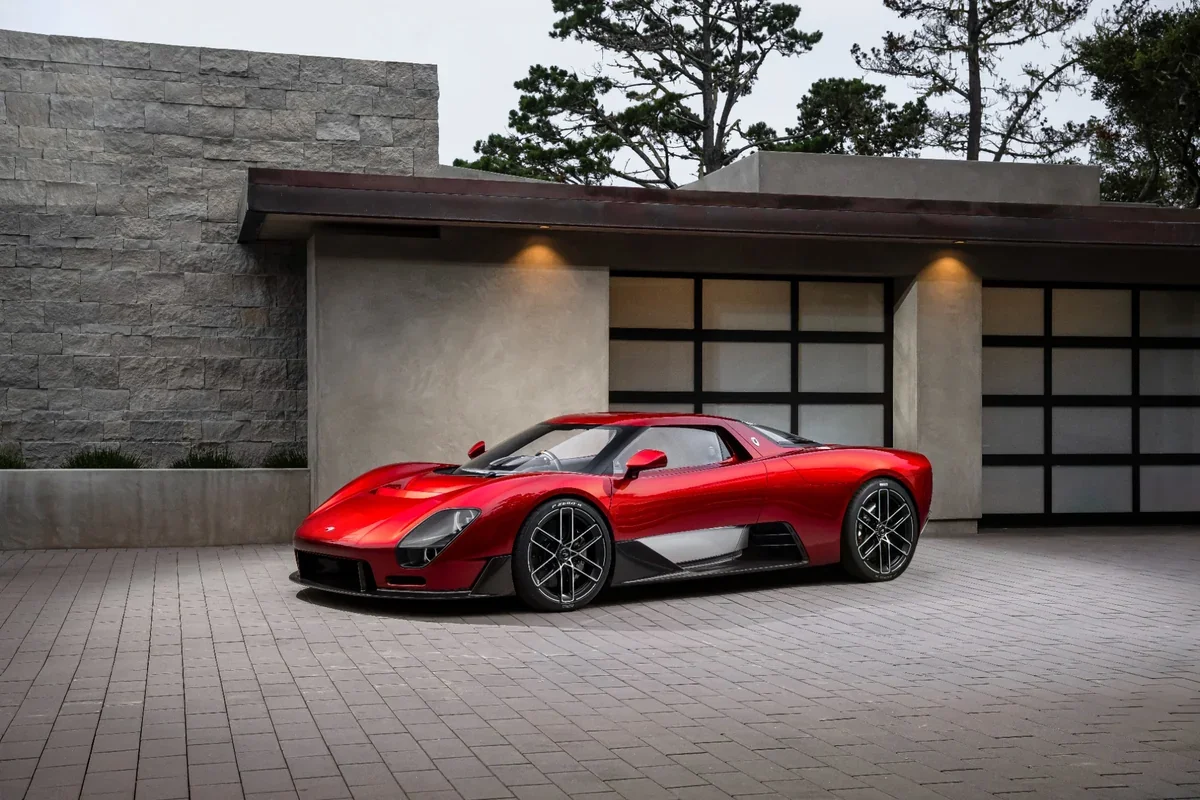 2028 McLaren McL 6GT red supercar front three-quarter exterior view