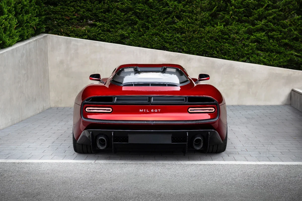 2028 McLaren McL 6GT rear view with Kammback tail and dual exhausts