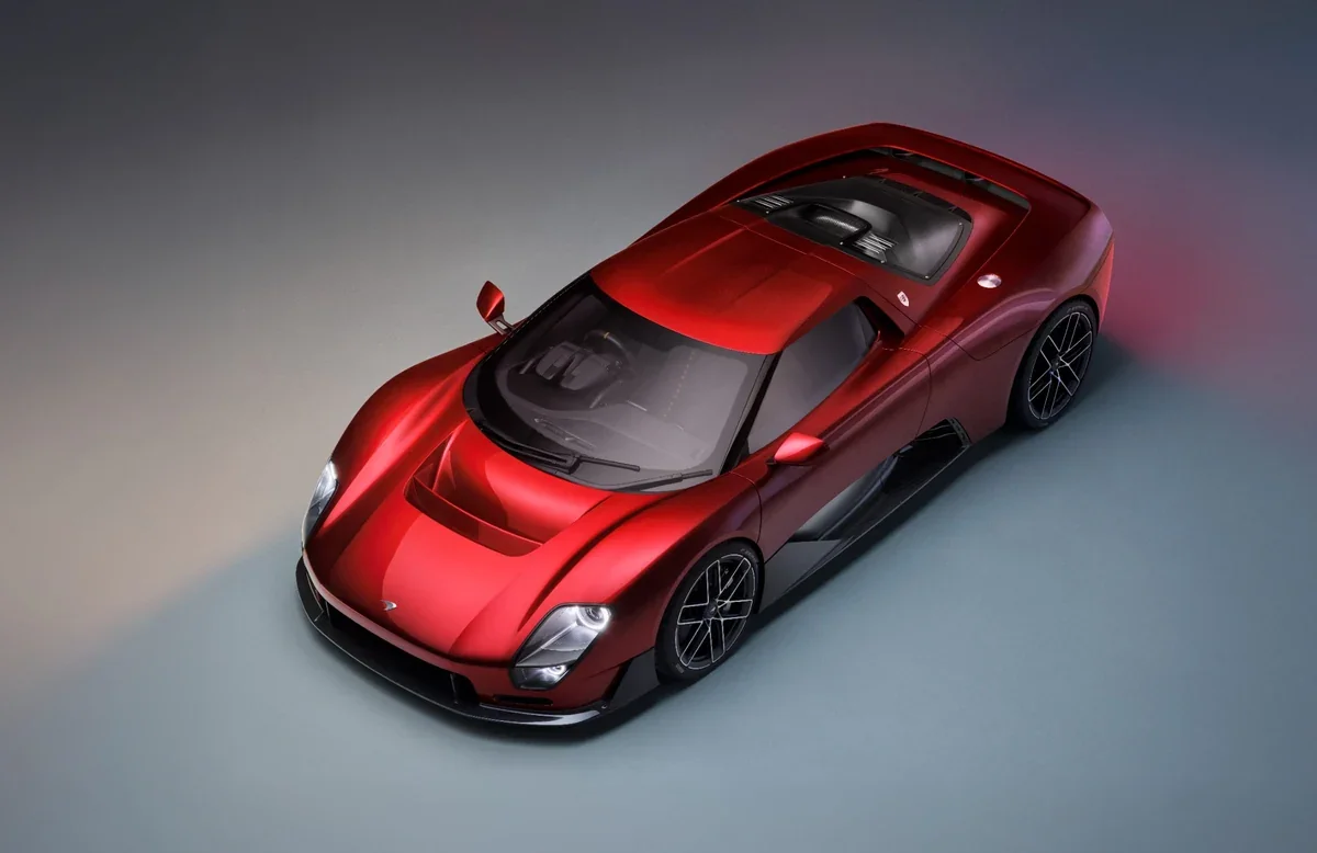 2028 McLaren McL 6GT red supercar studio top three-quarter view